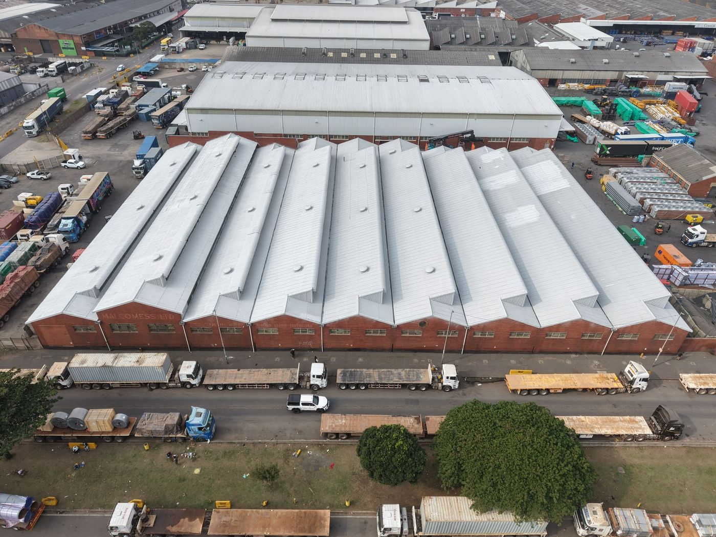 Multi-span warehouse roof sealed white