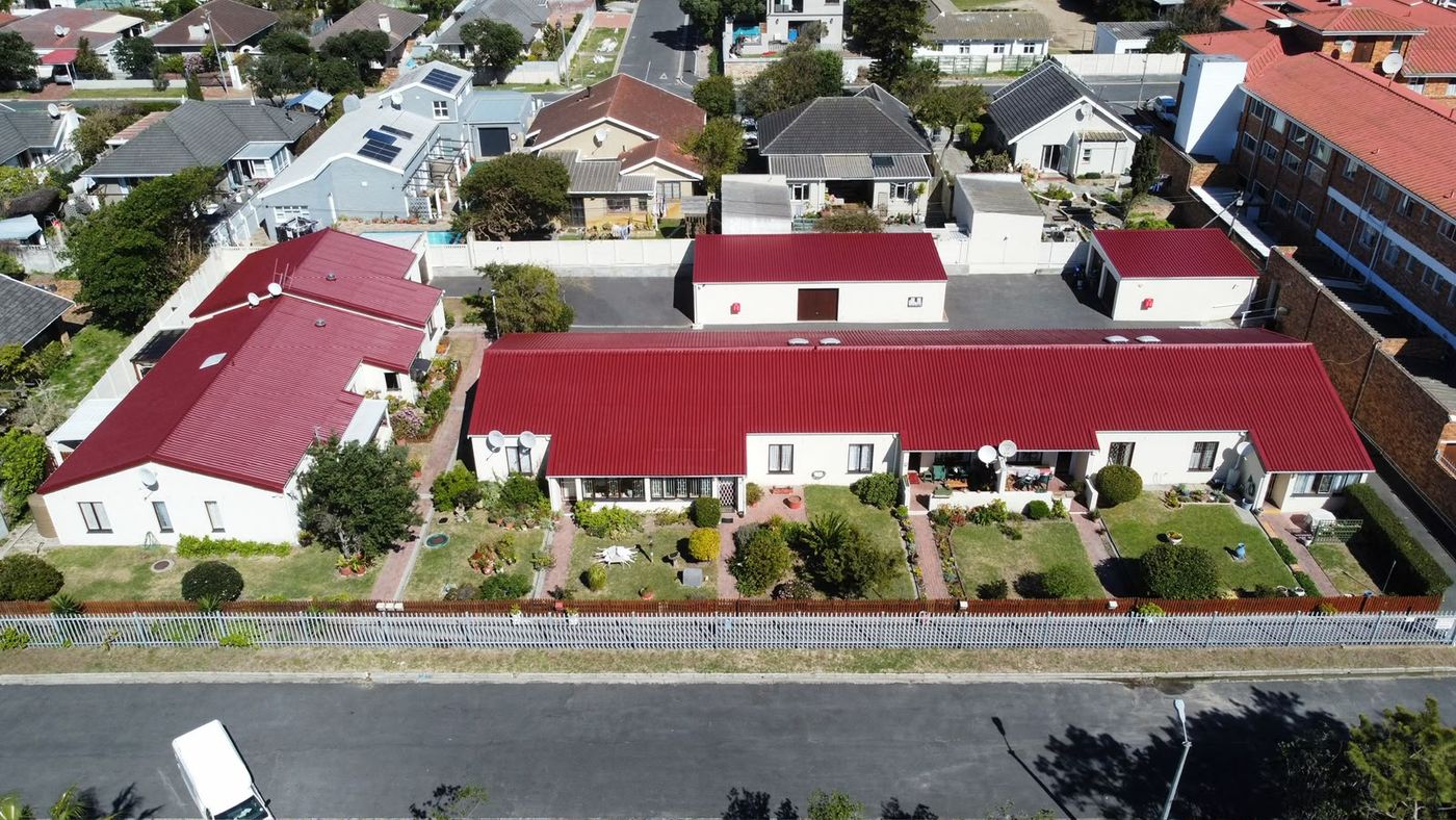 Row of homes with freshly painted red roofs