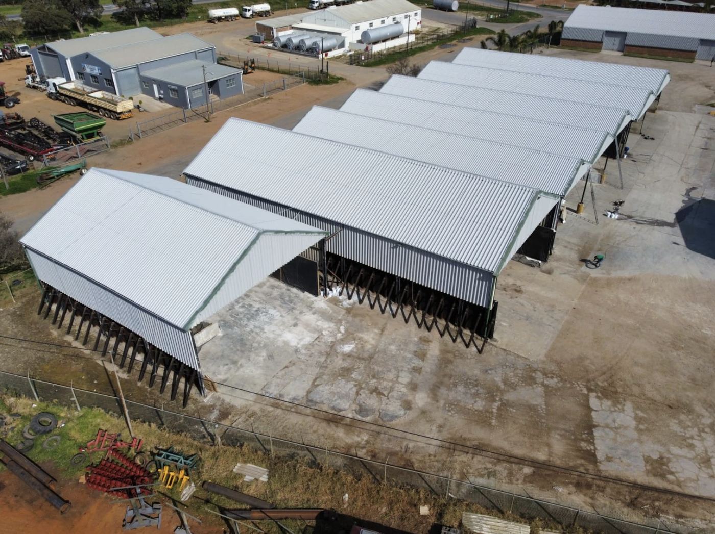 Row of farm sheds after encapsulation